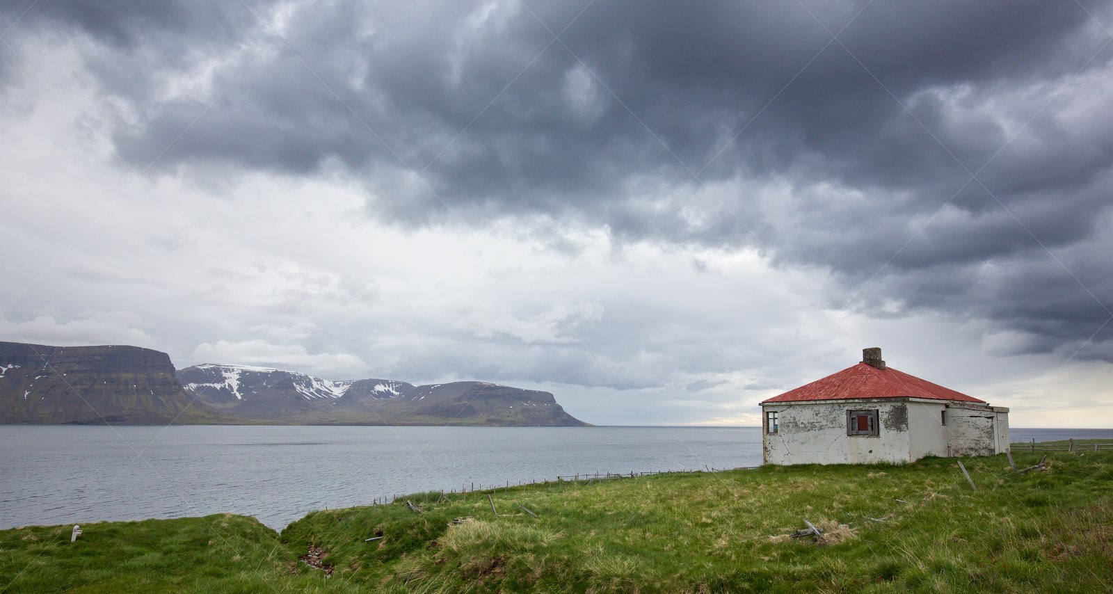 Fjord and abandoned building