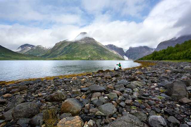 Rocky Beach with Glacier and Mountains