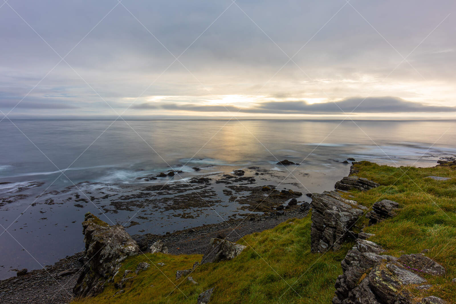 Rocky coastline at dusk in Árneshreppur Iceland
