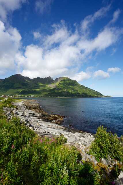 Coastal landscape with mountains and village in Senja Norway